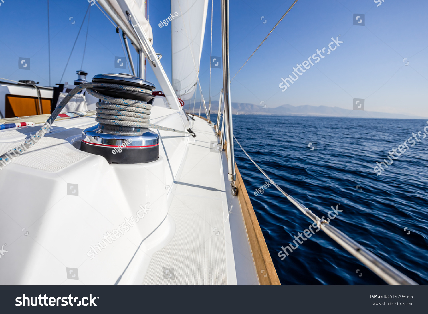 stock-photo-sail-vessel-surfing-on-the-sea-519708649